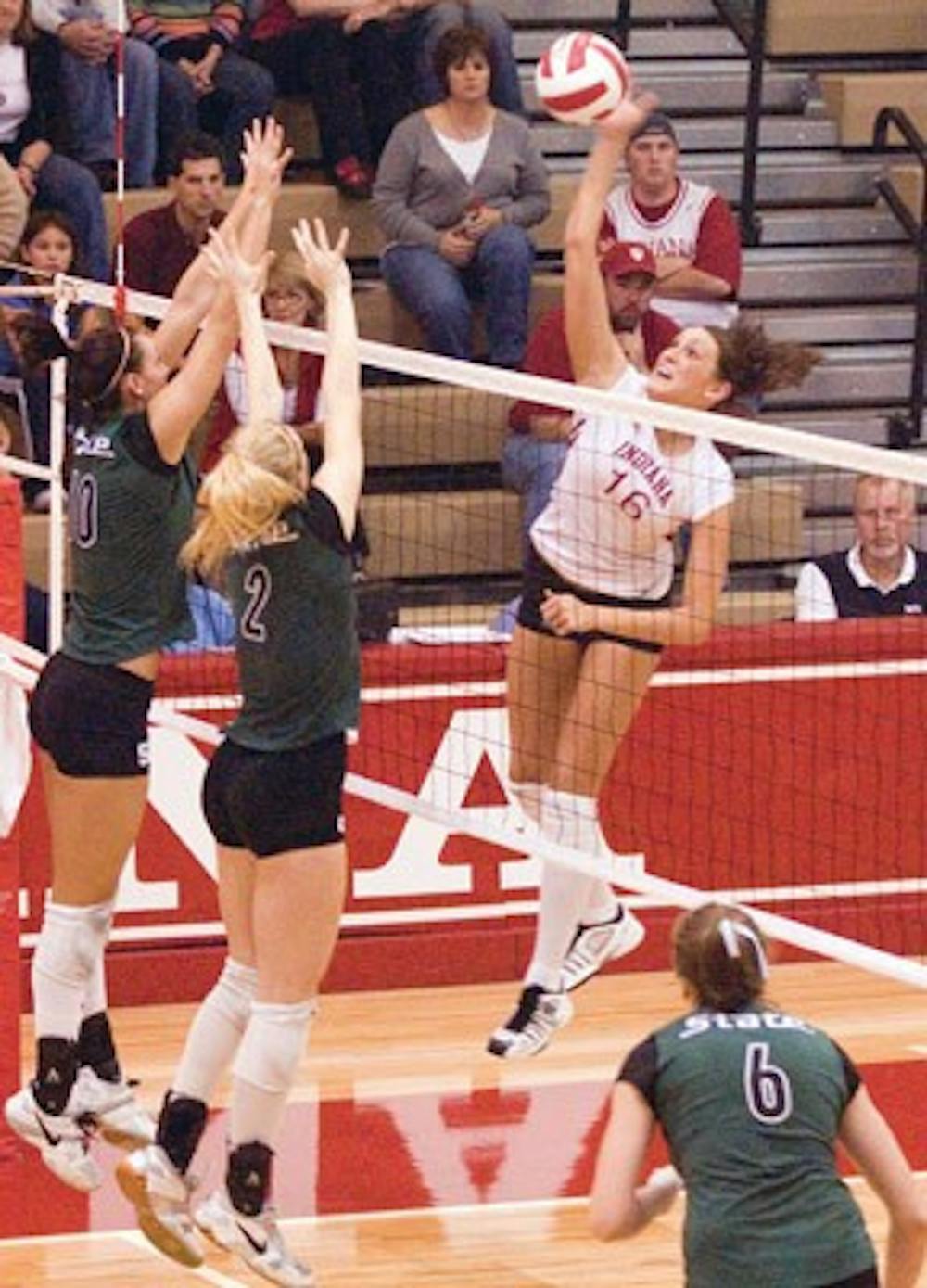 IDS File Photo
Junior outside hitter Gabrielle Allison prepares a spike against Michigan State juniors Jessica Hohl and Ashley Schatzle Nov. 24, 2006 evening at the University Gym.  The Hoosiers lost to the Spartans 3-0.