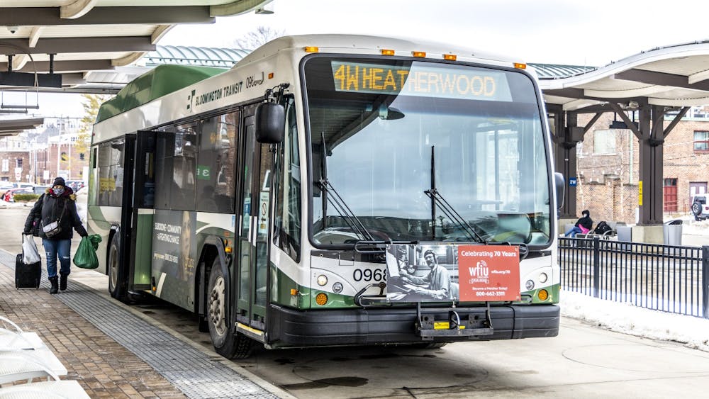 A woman boards a bus Feb. 22, 2021, at the Bloomington Transit Center. Masks will no longer be federally mandated on public transportation and in public transportation hubs.