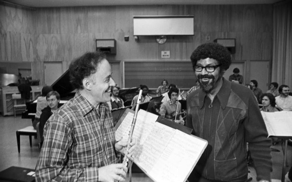 An IU News Bureau release dated Nov. 18, 1982, accompanies this image. It reads, in part: "James Pellerite and David Baker go over the score for Baker's 'Concerto for Flute and Jazz Band,' which Pellerite will perform with the IU Jazz Ensemble, Monday, Nov. 22, at 8 p.m. in the Musical Arts Center...""