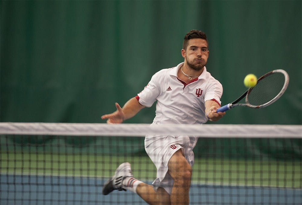 IU senior Sam Monette rushes towards the net to hit a forehand shot against Gijs Linders, a senior from Michigan State University, on April 20, 2015. at the IU Tennis Center. Monette lost the match 6-1, 3-6, 2-6.