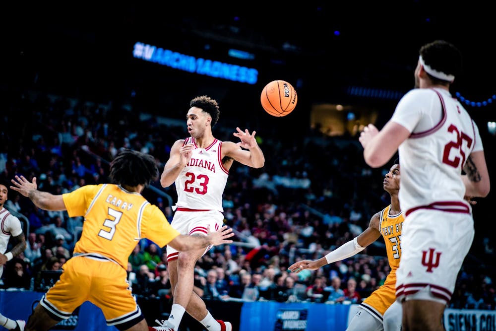 <p>Senior forward Trayce Jackson-Davis makes a no-look pass March 17, 2023, at MVP Arena in Albany, New York. Indiana defeated Kent State 71-60.</p>