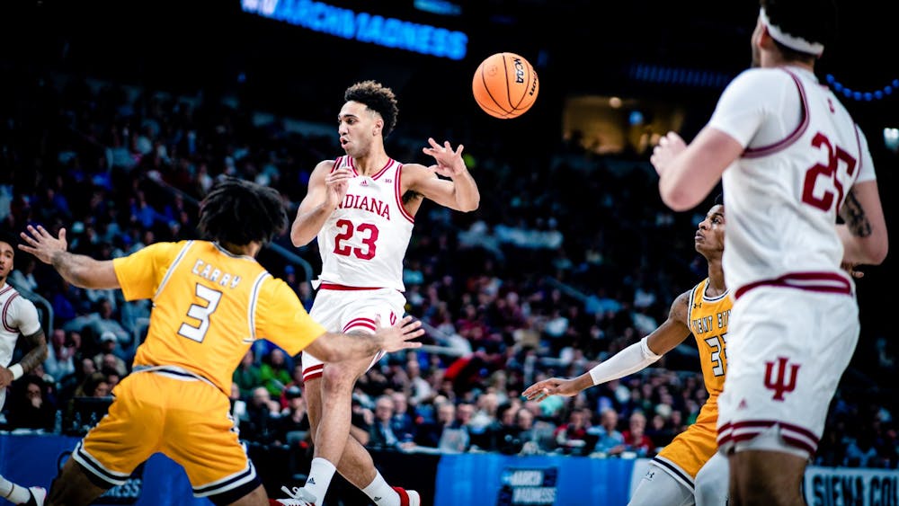 Senior forward Trayce Jackson-Davis makes a no-look pass March 17, 2023, at MVP Arena in Albany, New York. Indiana defeated Kent State 71-60.