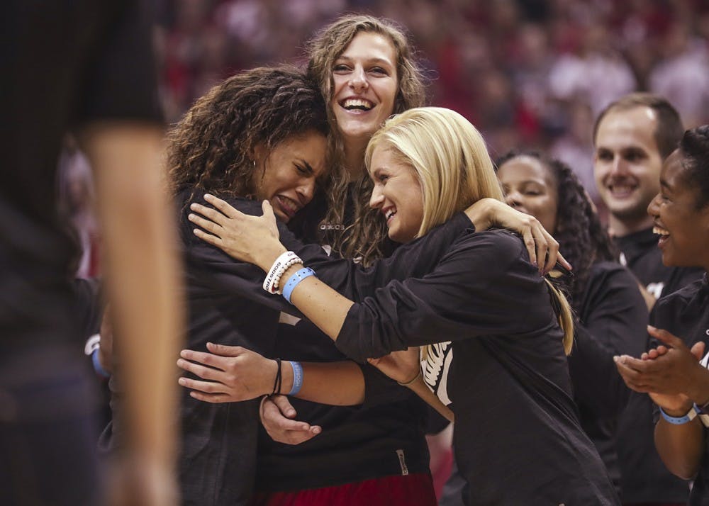 Sophomore forward Bre Wickware (left), senior forward Amanda Cahill (middle) and senior guard Tyra Buss (right) hug while Coach Teri Moren talks to the crowd during Hoosier Hysteria on Oct. 21. Buss and Cahill were two of 30 players nominated for the Senior CLASS Award on Jan. 4.