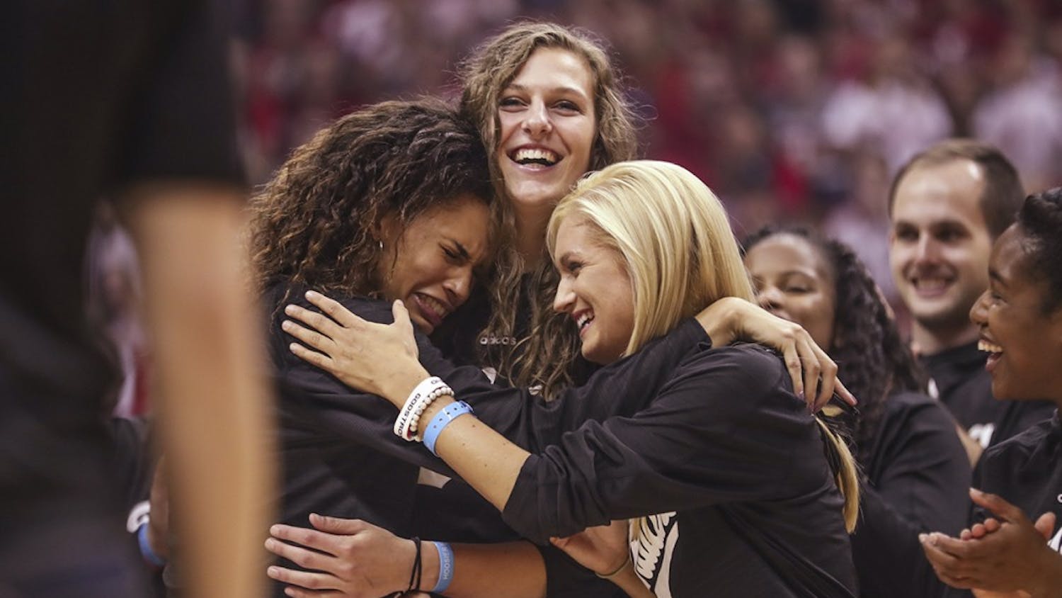 Sophomore forward Bre Wickware (left), senior forward Amanda Cahill (middle) and senior guard Tyra Buss (right) hug while Coach Teri Moren talks to the crowd during Hoosier Hysteria on Oct. 21. Buss and Cahill were two of 30 players nominated for the Senior CLASS Award on Jan. 4.