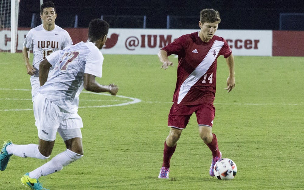 Senior defender Phil Fives dribbles the ball during Tuesday evening's 2-0 victory against IUPUI at Bill Armstrong Stadium.