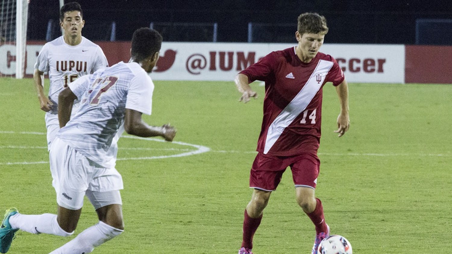 Senior defender Phil Fives dribbles the ball during Tuesday evening's 2-0 victory against IUPUI at Bill Armstrong Stadium.