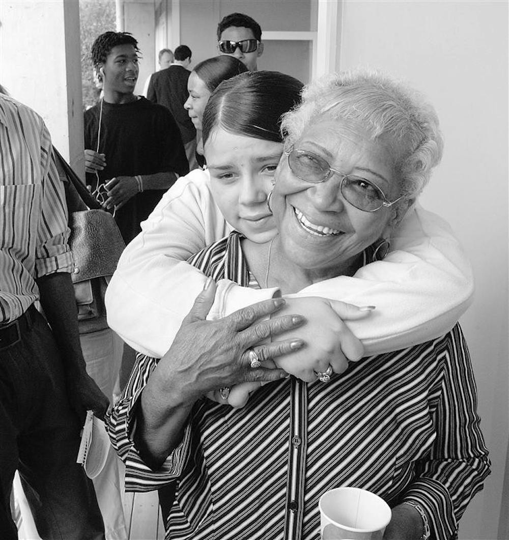 Home again – Gloria Guy gets a hug from her granddaughter, Coral Bourgeois, at an open house for her new home on Thursday in New Orleans.  Guy is receiving the home thanks to Brad Pitt’s “Make It Right “ program. The first few homes in Pitt’s rebuilding project in the city’s Lower 9th Ward are complete.