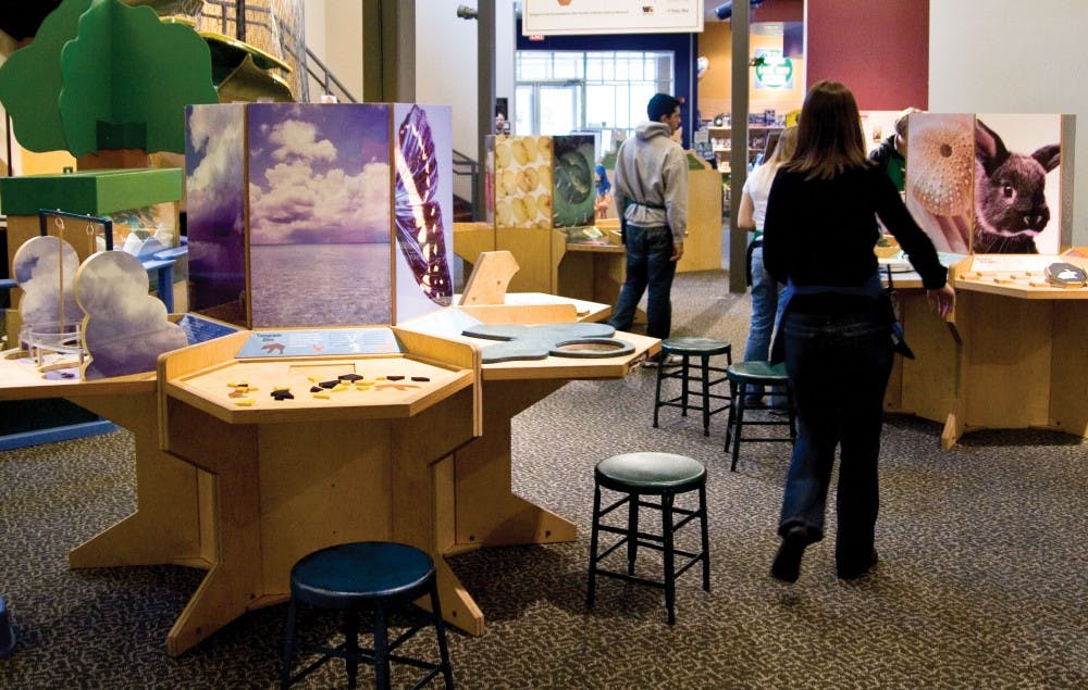 WonderLab visitors explore the center’s new “Nature’s Numbers” exhibit Saturday morning.  The exhibit, which opened Jan. 25, contains 20 interactive stations which feature the various patterns and shapes found in living things.