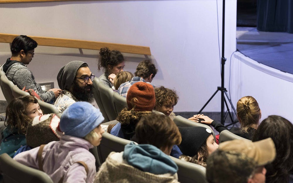 The audience waits for Kevin Locke to perform traditional Native American songs and dances. The performance took place Monday night at the Monroe County Library. 