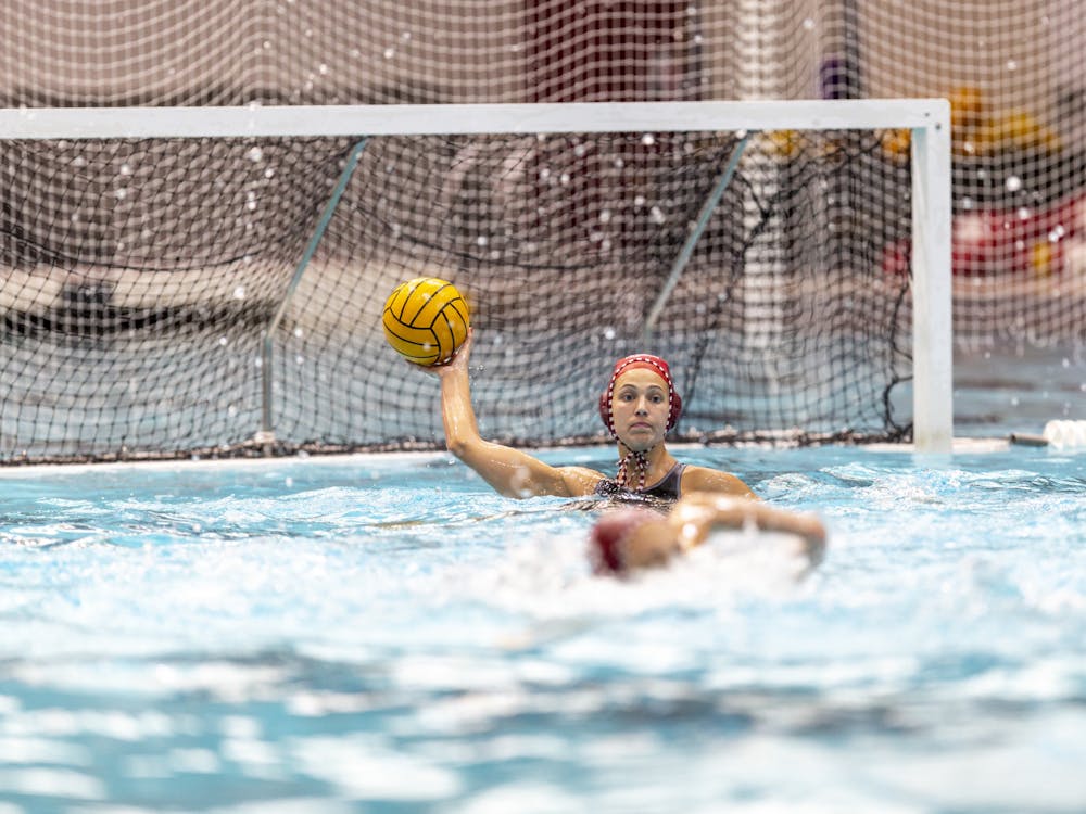Gradute Mary Askew throws the ball after stopping a goal April 8, 2023, at Counsilman-Billingsley Aquatics Center. Indiana lost to Michigan 9-8.