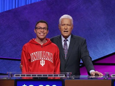 Senior Tyler Combs poses with &quot;Jeopardy!&quot; host Alex Trebek. Combs finished second in the 2020 College Championship finals Friday.