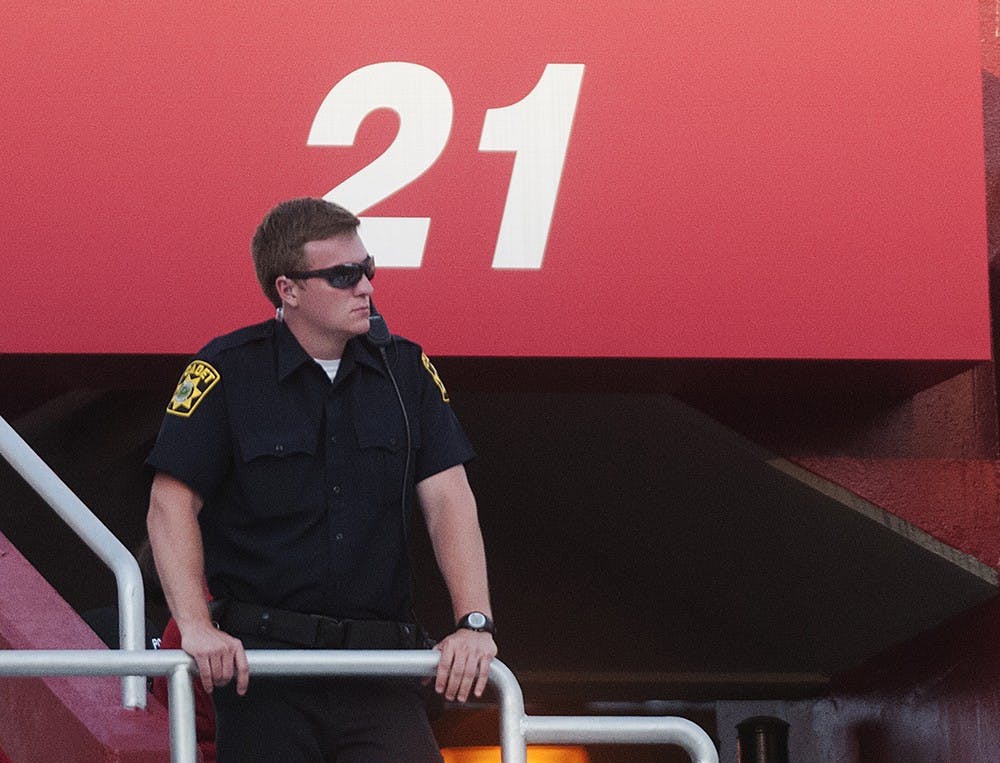 IUPD cadet Brian Babb watches the crowd during the game against Southern Illinois on Saturday at Memorial Stadium.