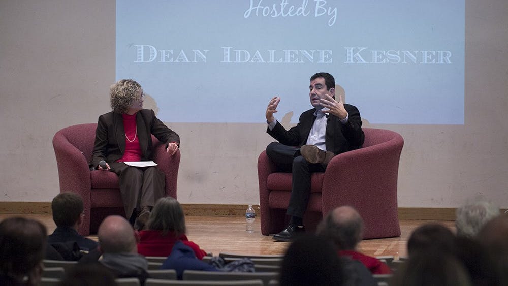 Author Ari Shavit is seen with Kelley School of Business Dean Idalene Kesner January 2015 in the Fine Arts Auditorium. Idalene Kesner announced April 8 she will step down as the dean of the IU Kelley School of Business and return to teaching effective July 31.