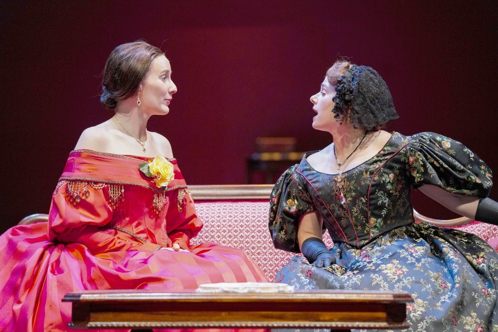 Catherine Sloper (left) and aunt Lavinia Penniman (right), portrayed by Glynnis Kunkel-Ruiz and Ellise Chase, socialize before a party during a rehearsal of Ruth and Augustus Goetz’ “The Heiress” on Sept. 18 in Ruth N. Halls Theatre. The story focuses on Catherine Sloper, a wealthy, socially awkward woman, who falls in love with a man that her father believes is only after their money.