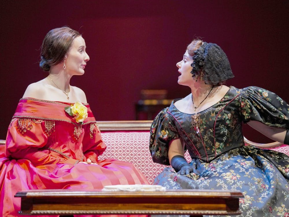 Catherine Sloper (left) and aunt Lavinia Penniman (right), portrayed by Glynnis Kunkel-Ruiz and Ellise Chase, socialize before a party during a rehearsal of Ruth and Augustus Goetz’ “The Heiress” on Sept. 18 in Ruth N. Halls Theatre. The story focuses on Catherine Sloper, a wealthy, socially awkward woman, who falls in love with a man that her father believes is only after their money.