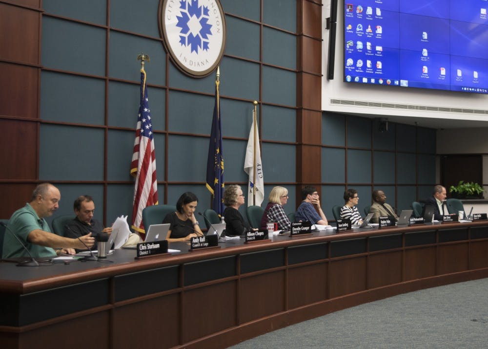 City council members listen as Mayor John Hamilton urges them to pass the two agenda items at at the city council meeting Wednesday evening. He endorsed Resolution 17-38, which would create a food and beverage tax of one percent to finance expansions on the Monroe County Convention Center, and Ordinance 17-39, which would authorize an annexation between the City of Bloomington and Cook Medical.&nbsp;
