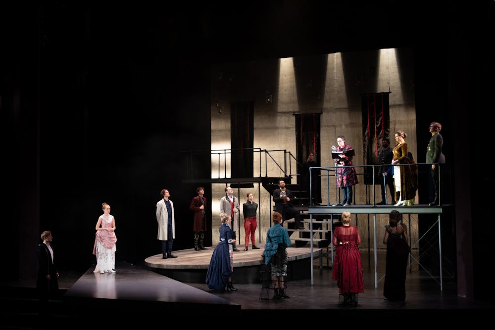 <p>The cast of “Hamlet” stands on stage Dec. 3, 2019, during the first act in the Ruth N. Halls Theatre. Director Jonathan Michaelsen cast more women than men in this production of “Hamlet.”</p>
