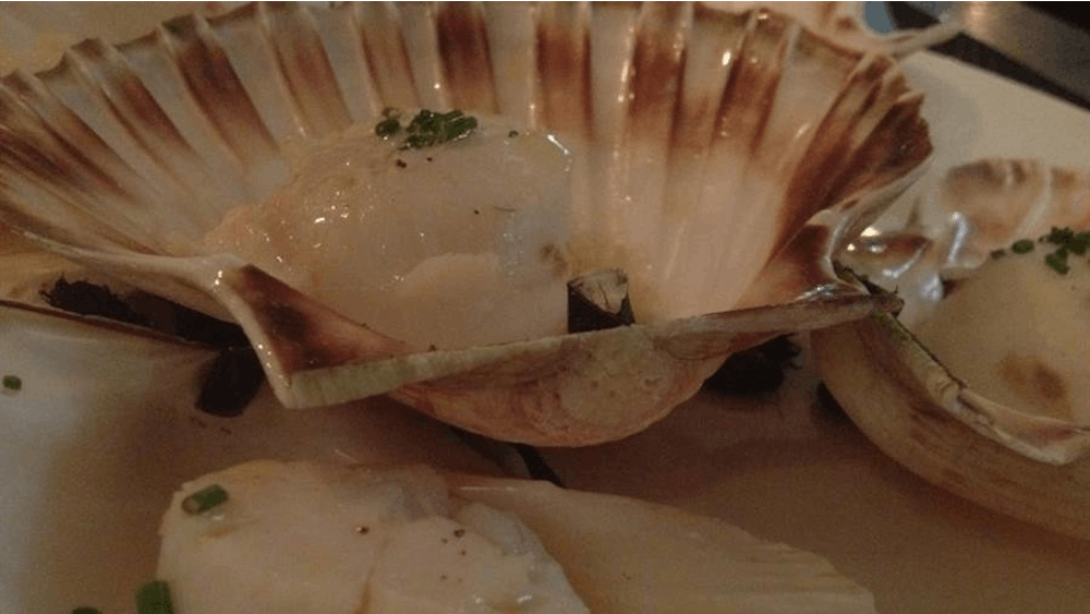 The coquille dish is served at a restaurant in Paris. Many restaurants in Paris have switched to iPad menus. 