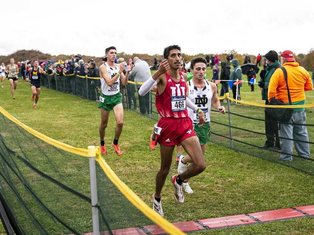 Then-senior Arjun Jha runs during NCAA Great Lakes Regional on Nov. 12, 2021, in Evansville, Indiana. IU will host the Coaching Tree Invitational to honor the legacy of head coach Ron Helmer on Sept. 16.
