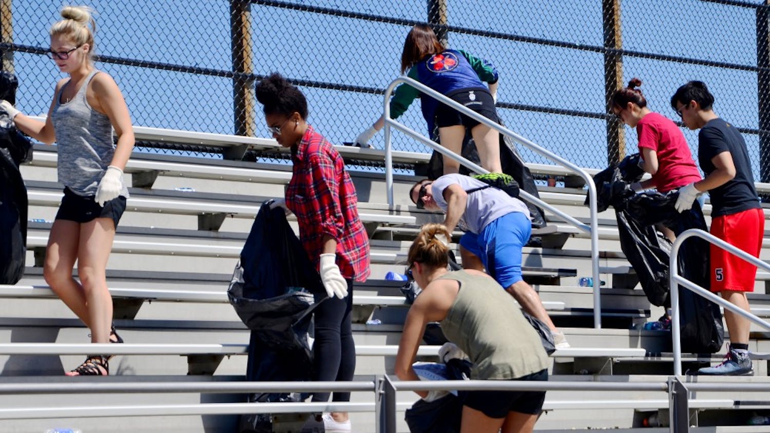 Students who have received a drinking violation ticket during the Little 500 weekend pick up trash as a part of the pretrial diversion program in 2016 at Bill Armstrong Stadium. Little 500 will take place this coming weekend with the women's race Friday at 4 p.m. and the men's race Saturday at 2 p.m.