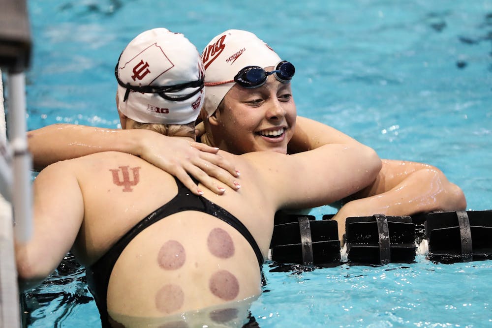 <p>Then-freshmen Ryley Ober and Katrina Somner hug Feb. 21, 2020, during the Big Ten Championship at the Campus Recreation and Wellness Center in Iowa City, IA. </p>