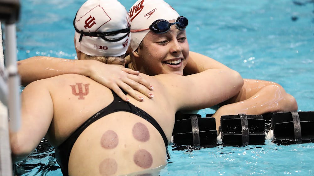 Then-freshmen Ryley Ober and Katrina Somner hug Feb. 21, 2020, during the Big Ten Championship at the Campus Recreation and Wellness Center in Iowa City, IA. 