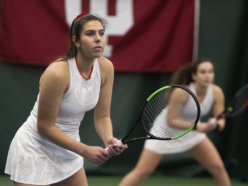 Then-senior Annabelle Andrinopoulos and then-junior Jelly Bozovic compete Feb. 2, 2020, at the IU Tennis Center in doubles in a match against Xavier University.