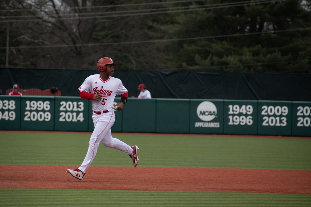 <p>Freshman outfielder Devin Taylor looks back while running the bases March 21, 2023, at Bart Kaufman Field in Bloomington. Two Indiana baseball players took home weekly Big Ten honors on Monday.</p>