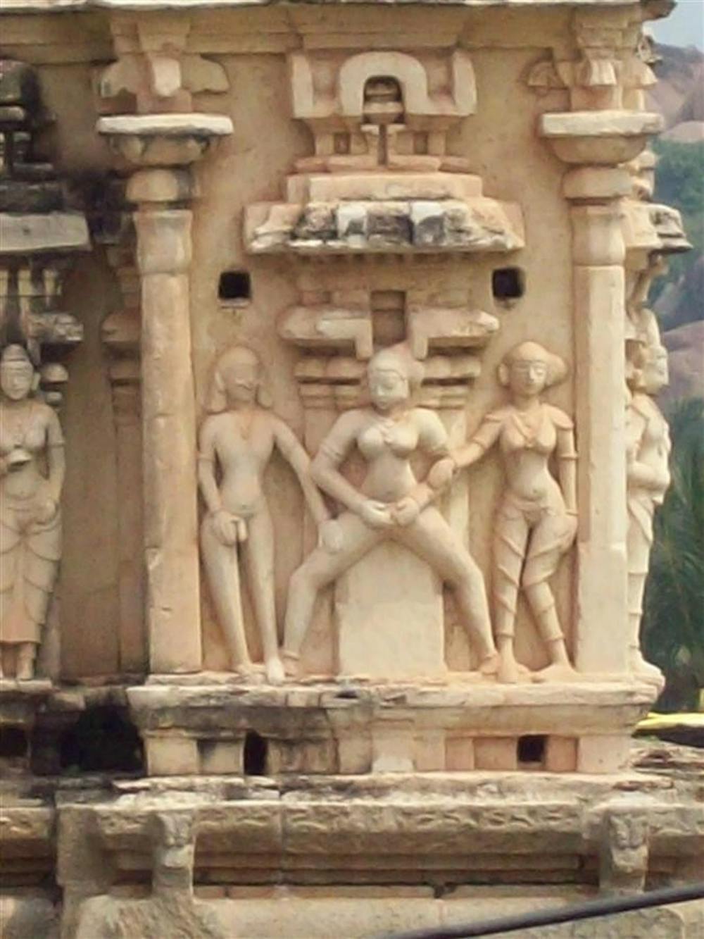 A temple decoration in Hampi, a village within an area of ruins in south-central India, depicts a woman exposing herself. The carving was either for decoration or to demonstrate part of the "Kama Sutra," but accounts vary and exact records are lost.