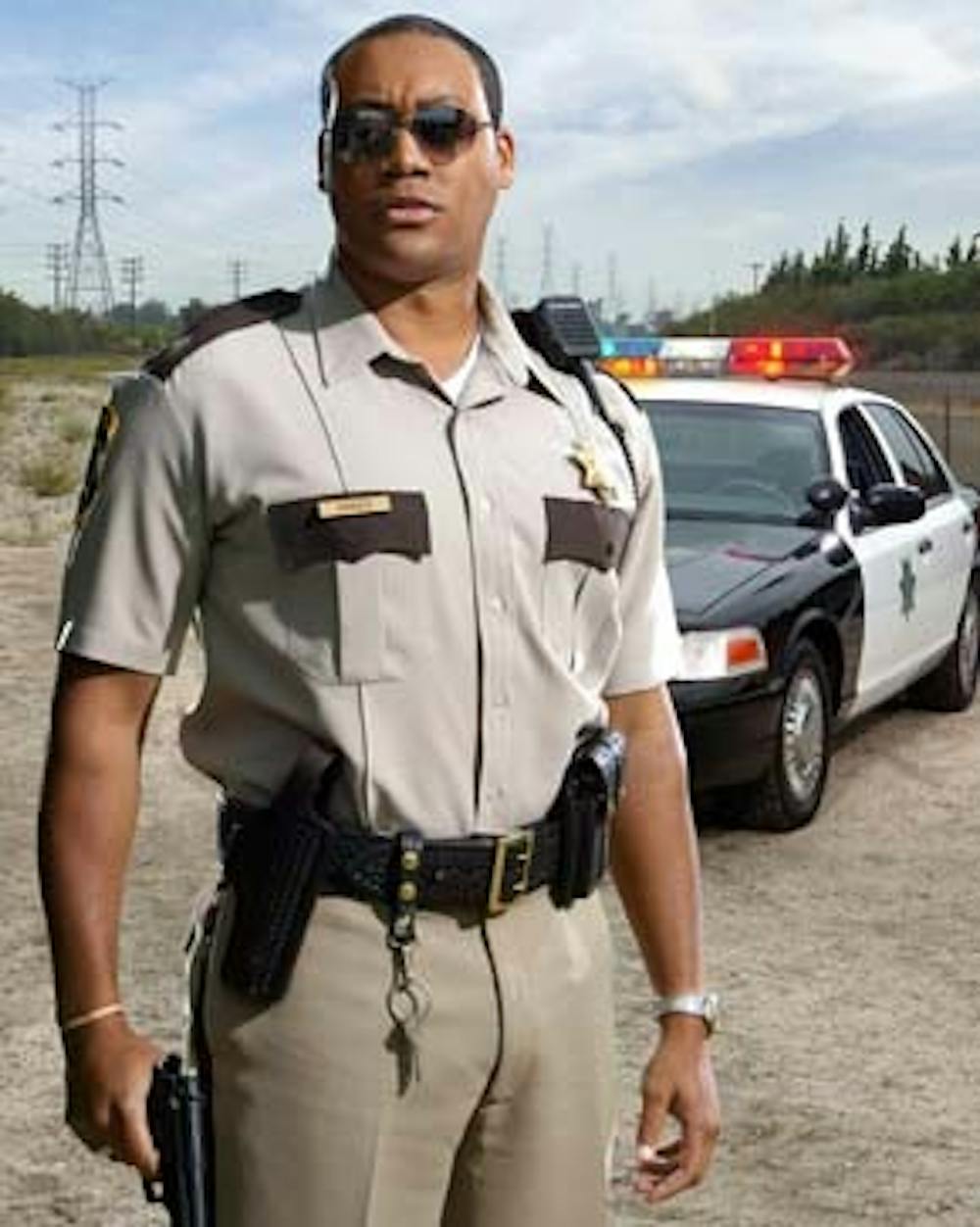 Cedric Yarbrough as "Deputy S. Jones" was once described as "a big, hardworking, robust, sort of mocha-ish person" by Lieutenant Dangle in a D.A. deposition. Photos courtesy Comedy Central