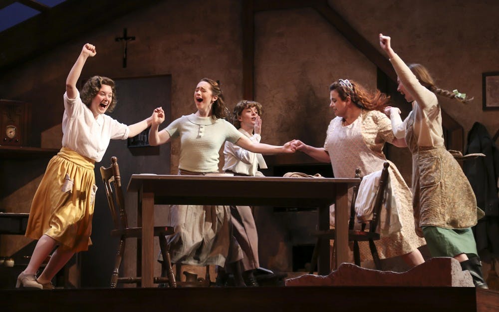 Performers dance during a scene of "Dancing at&nbsp;Lughnasa." The show opens Friday in the&nbsp;Ruth N. Halls Theatre.