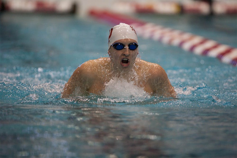 Senior Grayson Smith swims the breaststroke leg of the 400 IM on Friday night at the Hoosierland Invitational.