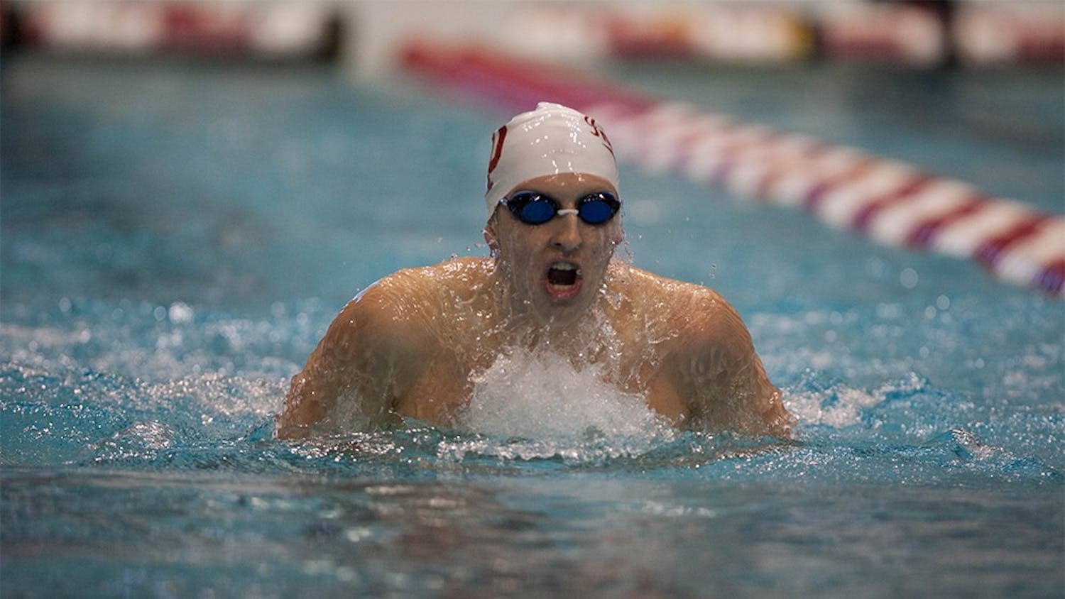 Senior Grayson Smith swims the breaststroke leg of the 400 IM on Friday night at the Hoosierland Invitational.