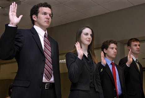 Members of the Big Red ticket get sworn in Monday evening after a lengthy elections process. Big Red was named winners of the IUSA election after the IUSA Supreme Court disqualified the Kirkwood ticket for violating six election codes.