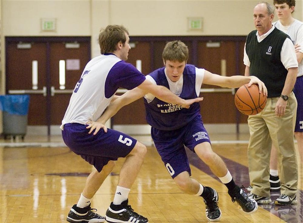 Bloomington South senior guard Jordan Hulls, an IU recruit, drives past a team mate in a scrimmage as coach J.R. Holmes, right, watches during practice Thursday at the school. Bloomington South, the No. 1 class 4A school in the Associated Press coaches poll, will face Detroit Country Day on Saturday in Bloomington.