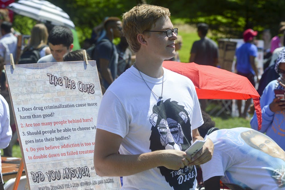 Senior Brandon Lavy mans the table for his group AgainstPROHIBITION Monday afternoon at the Student Involvement Fair to induct new students into his organization. The organization actively aims to shift drug policies throughout the nation.