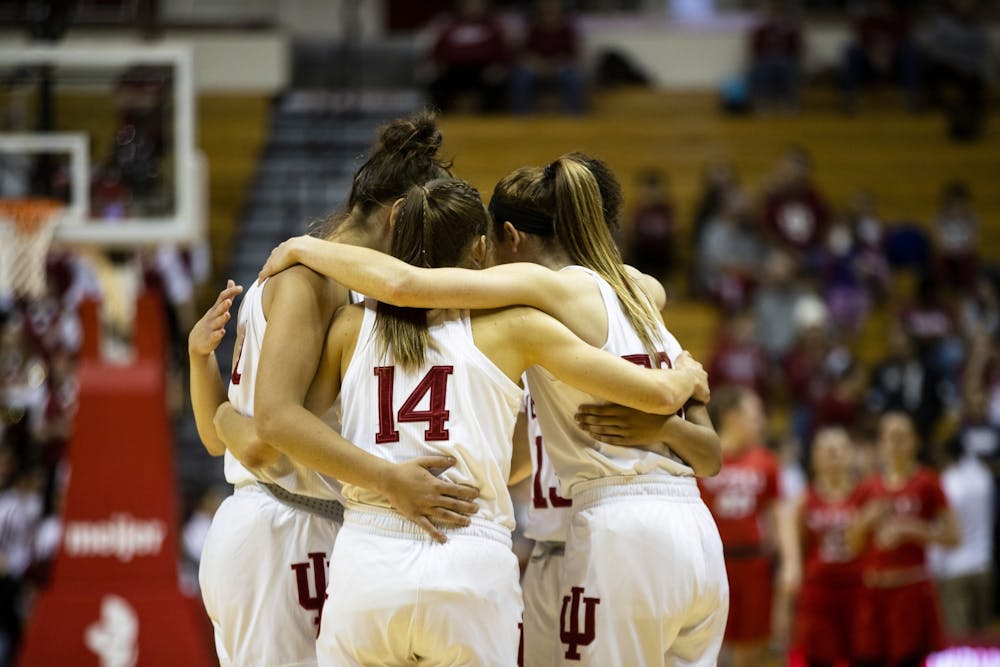 <p>IU women’s basketball huddles up before their game Dec. 15 at Simon Skjodt Assembly Hall. IU beat Penn State Jan. 23, 76-60.</p>