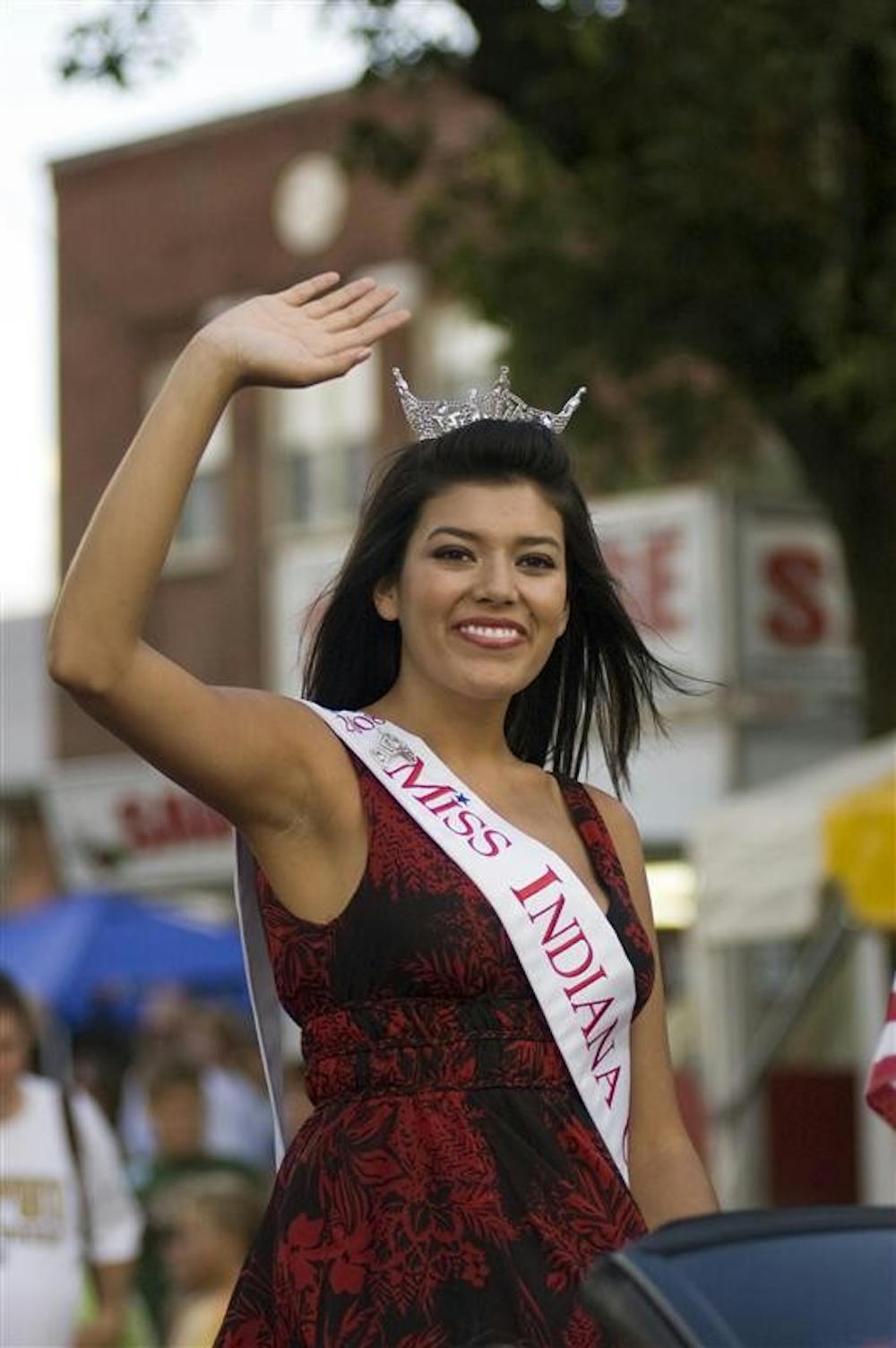 Miss Indiana University Gabrielle Reed waves during a IU Day parade on Aug. 7 at the Indiana State Fair in Indianapolis.