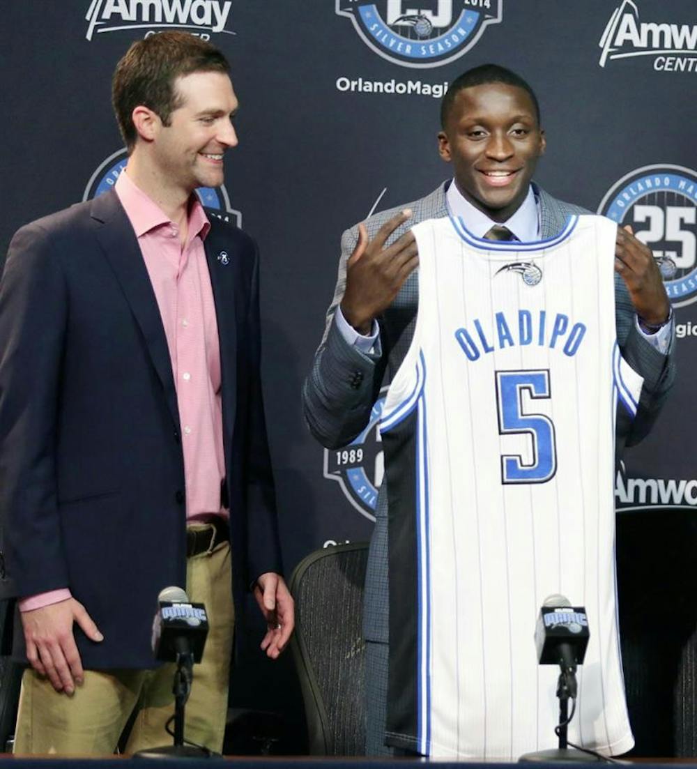 General Manager Rob Hennigan, left, introduces Victor Oladipo, NBA draft pick of the Orlando Magic, at a news conference June 28 in Orlando, Florida.