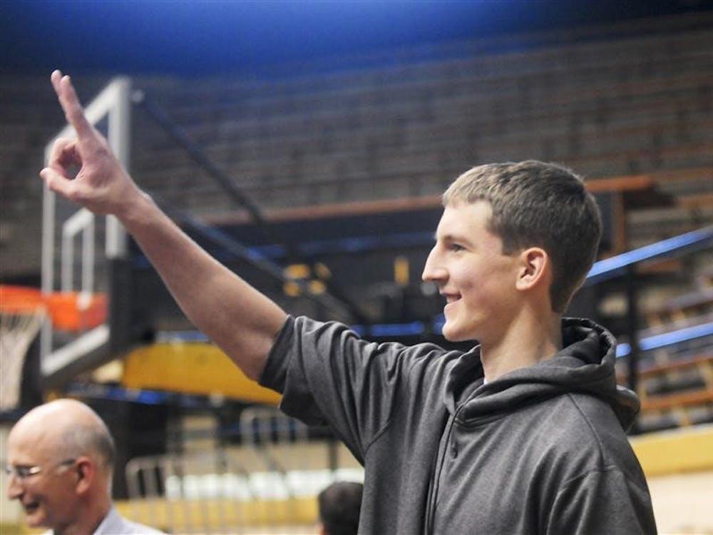 Washington (Ind.) High School senior Cody Zeller gestures to friends during his press conference on Nov. 11, 2010 in Washington High School's gym. Zeller held the press conference to announce his decision to commit to IU instead of Butler or North Carolina. 