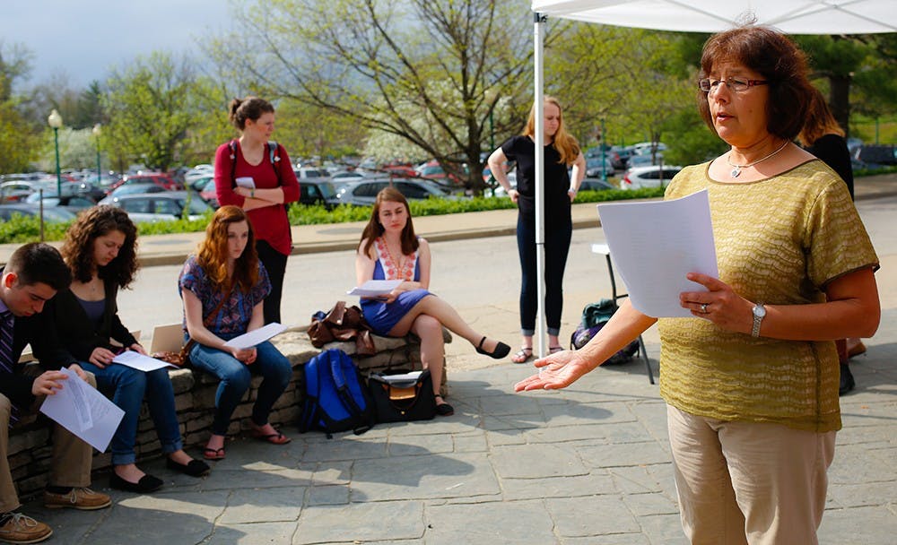 Rabbi Sue Silberberg, an executive director at Helene G. Simon Hillel Center speaks about the Holocaust during a Holocaust Remembrance Day event Thursday at the Woodburn Clock. 