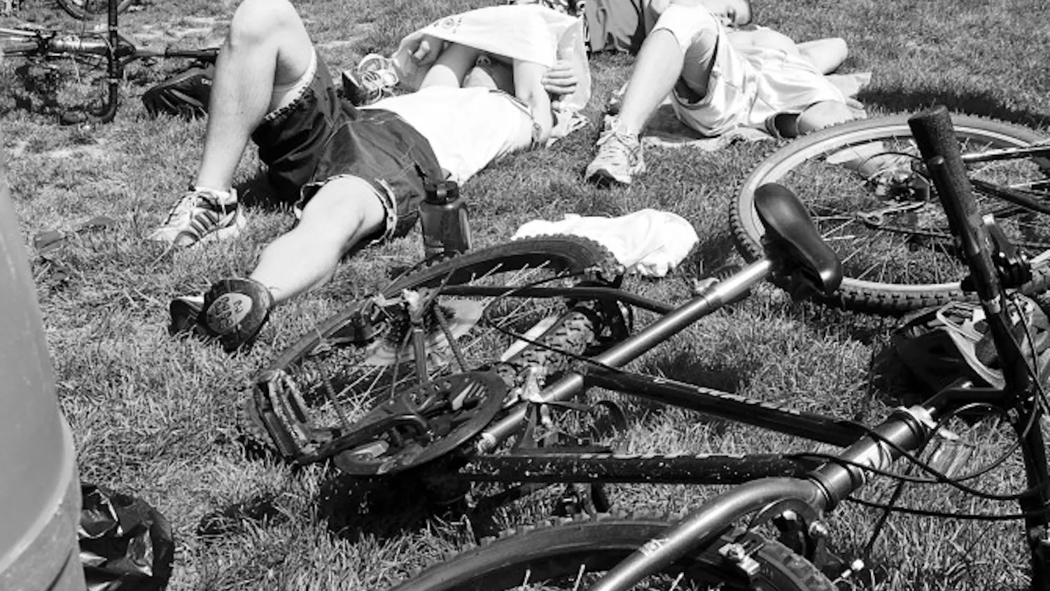 Jacob Wick, Joey Tharp, and Jim Wollenburg of team Triple Threat rest Saturday while waiting for other teams to finish the second annual Hoosier Hustle at Third Street Park. Team Triple Threat was the first team back to the park at the end of the race.