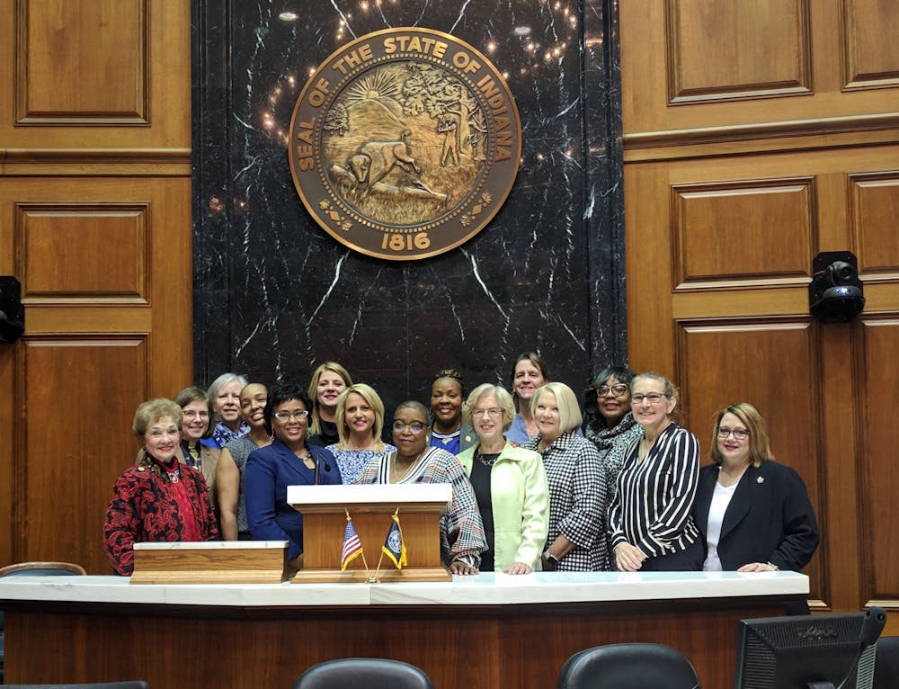<p>Members of the Indiana House Democratic Caucus stand in the State House. Female caucus members created a list of bills that introduced policies that relate to women in honor of the 100th anniversary of women being allowed to vote. </p>