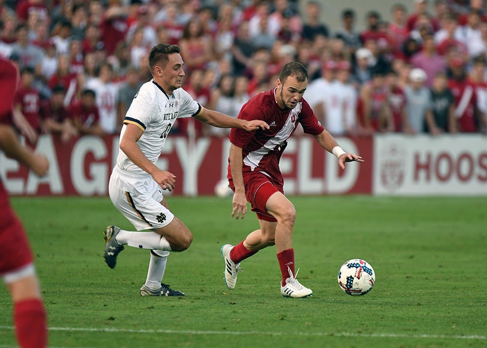 Then-junior, now senior defender Andrew Gutman dribbles the ball against Notre Dame on Sept. 26, 2017 at Bill Armstrong Stadium. No. 4 IU will travel to South Bend Tuesday night to take on No. 12 Notre Dame.&nbsp;