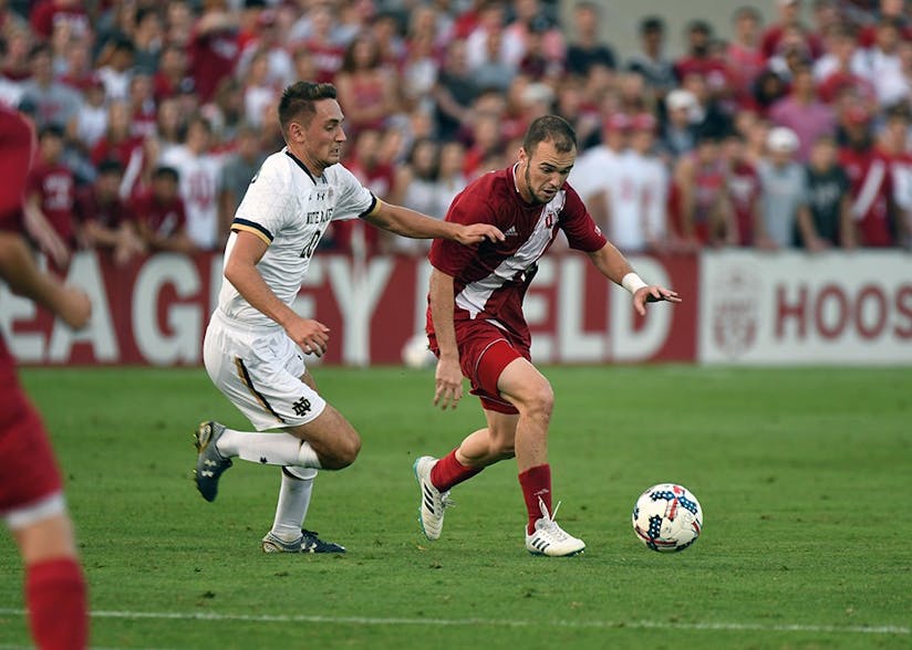 Then-junior, now senior defender Andrew Gutman dribbles the ball against Notre Dame on Sept. 26, 2017 at Bill Armstrong Stadium. No. 4 IU will travel to South Bend Tuesday night to take on No. 12 Notre Dame.&nbsp;