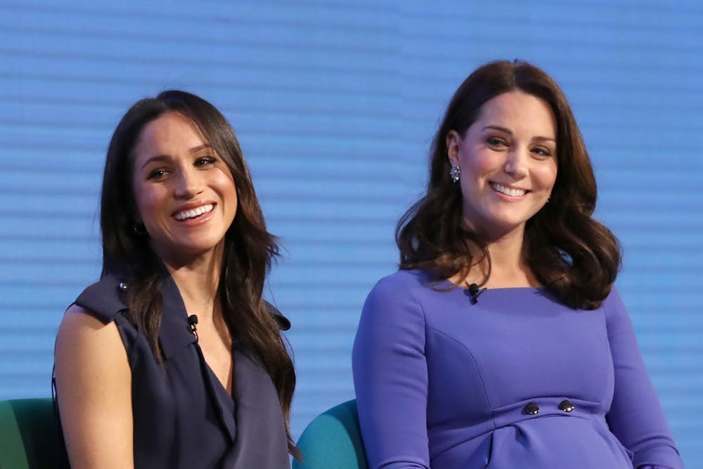 Meghan Markle, left, and Catherine, Duchess of Cambridge, attend the first Royal Foundation Forum on Feb. 28, 2018, in London.