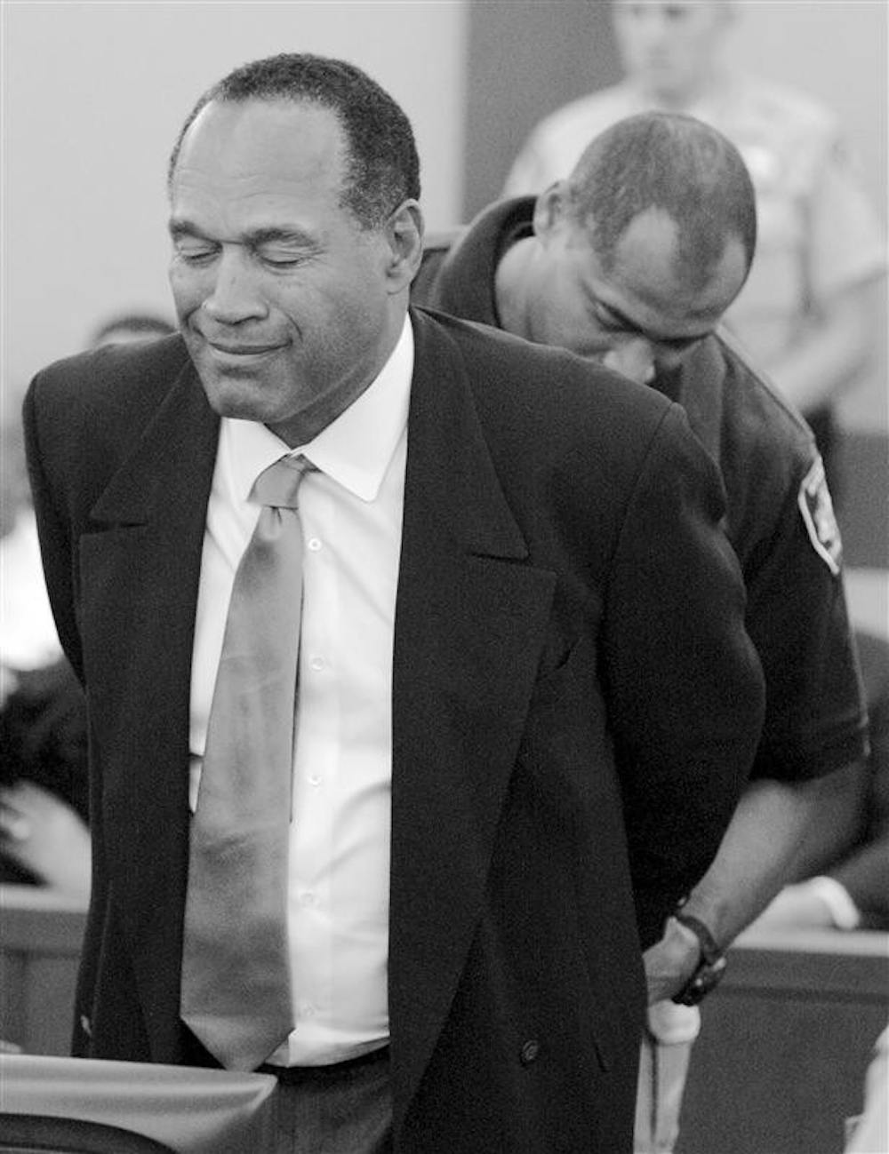 O.J. Simpson is taken into custody after being found guilty on all 12 charges, including felony kidnapping, armed robbery and conspiracy on Friday at the Clark County Regional Justice Center in Las Vegas. The verdict comes 13 years to the day after he was acquitted of double murder charges. 