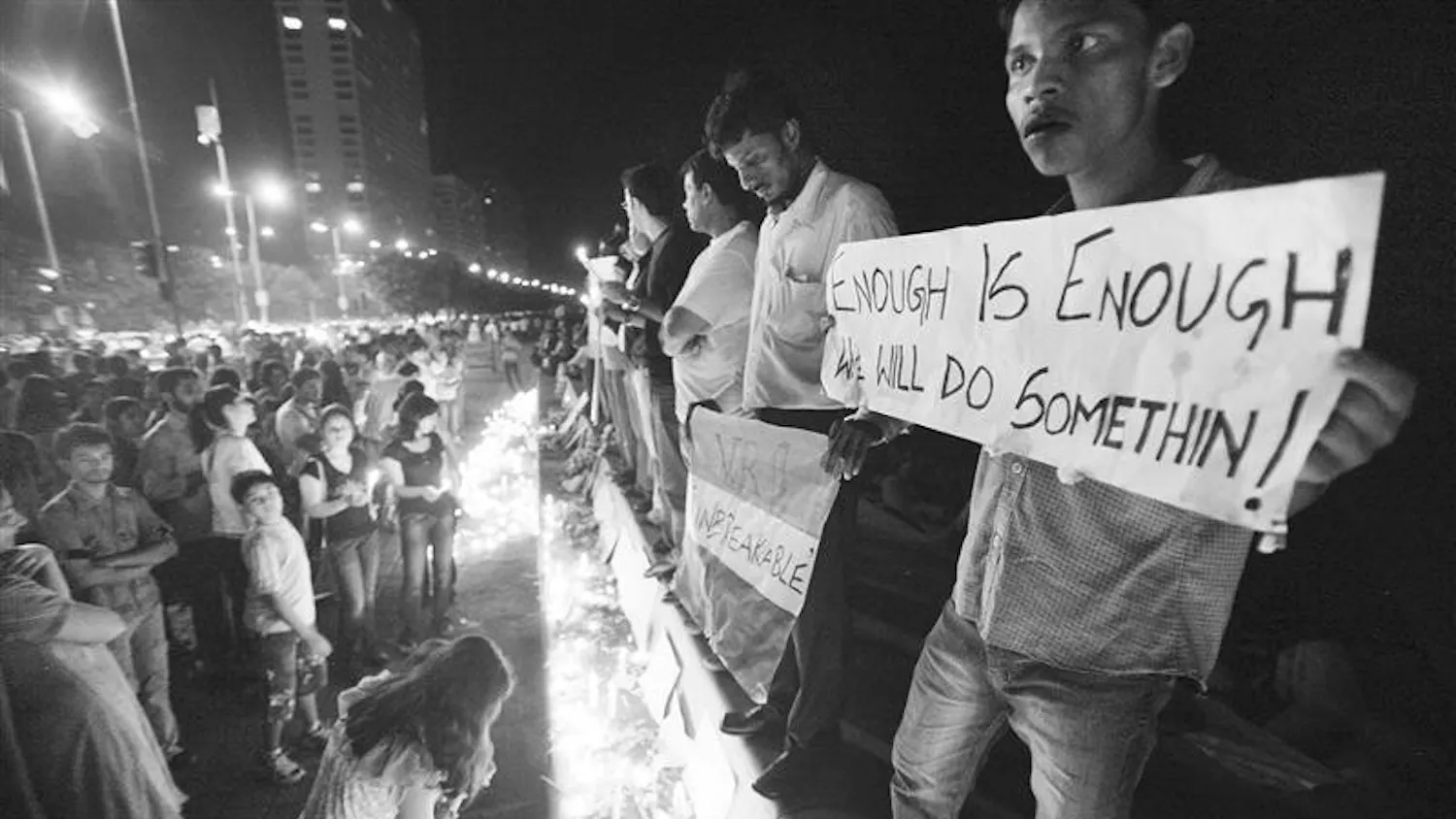 Residents of Mumbai hold a candlelight ceremony and a protest on Sunday after attacks on the city killed at least 174 people. The death toll was revised down Sunday from 195 after authorities said some bodies were counted twice, but they said it could rise again as areas of the Taj Mahal were still being searched. Among the dead were 18 foreigners, including six Americans. Nine gunmen were killed.