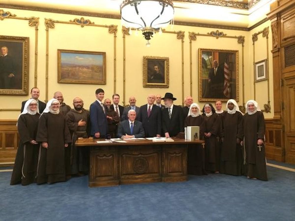 Governor Mike Pence signs into law the Religious Freedom Restoration Act on Thursday. 