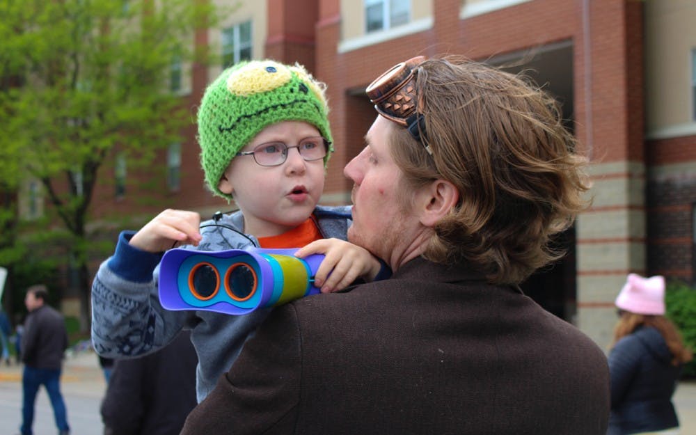 Theodore Williamson, 4, checks out the crowd of science lovers around him. The Williamson family attended the Indianapolis March for Science on Saturday. 